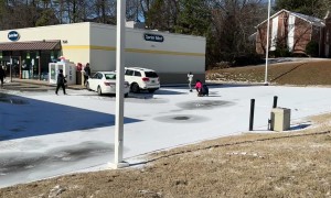 SUV Slides Down Hill and Collides With Car in Icy Parking Lot