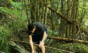 Man Falls Crossing Branch Over Stream