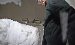 Man Groans After Snow Pile Collapses
