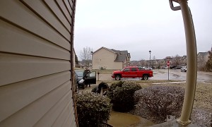Girl Laughs As Mom Slides Down Sidewalk