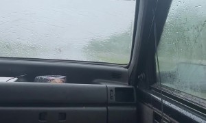 Couple Clever Solution to Broken Windshield Wipers
