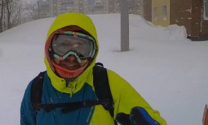 Man Crosses the Street During an Intense Blizzard