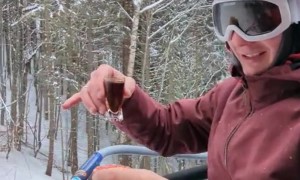 Skier Enjoys a Meal on Chairlift