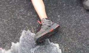Woman Soaks Man Working Under Car