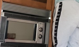 Rescuing A Cat Behind The Microwave