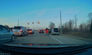 Man Unloads Shopping Cart From Road Shoulder