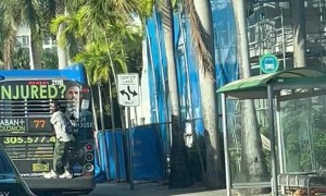 Guy Rides On Back Of Miami Dade Bus