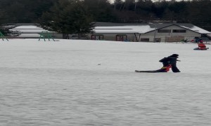 Mother Drags Sleepy Boy on Ski Slope