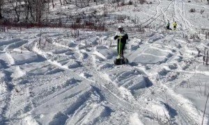 Electric Snowboards Cruise Up and Down Snowy Hill