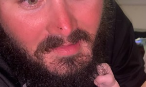 Feeding Baby Clutches Dad's Beard