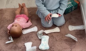 Toddler Plays With Pads