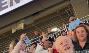 Guy Throws Free Pizza Into the Crowd At Detroit Monster Jam