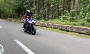 Motorcycle Rider Attempting Wheelie Ends up on Pavement