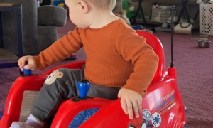 One-Year-Old Nods Off While Driving Toy Car