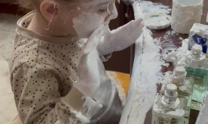 Little Girl Covers Herself in Lotion