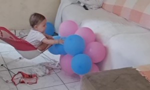 Baby Plays With Balloons