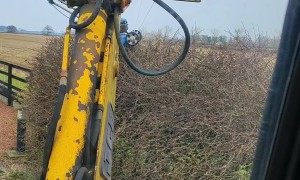 Using a Crane to Cut Hedges