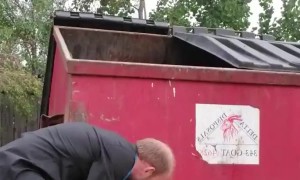 Man Helps Raccoon Stuck Under Dumpster