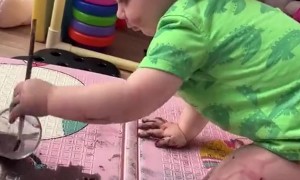 Little Girl Paints With Watercolor