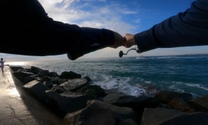 Fisherman Knocked Down by Wave While Fighting a Large Catch
