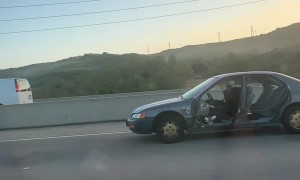 Car Missing All Four Doors Driving on Highway