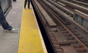Man Walking Down Train Tracks