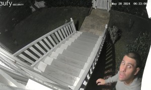 Man Falls Trying to Take Down Security Camera