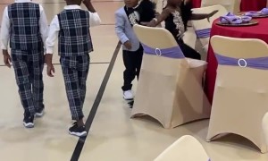 Miniature Gentleman Pushes Lady's Chain In