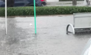 Man Kayaking on Flooded Street