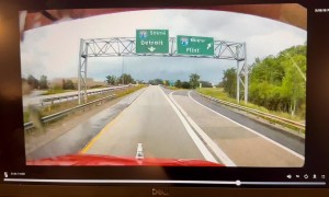 Car Jumps Across Detroit Highway