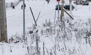 Car Slides Down Snowy Hill In Coyhaique