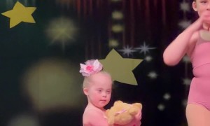 Daughter With Down Syndrome And Her Big Sister At Ballet Recital