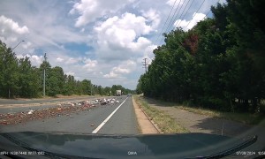 Garbage Truck Leaves Trash Strewn All Over Road