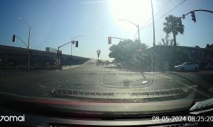 Driver Gets Hit By Red-Light-Running Car