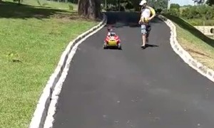 Kid Laughs Down Hill Until Stroller Hits Curb