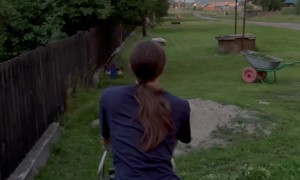 Woman Astonished By Lighting While Mowing