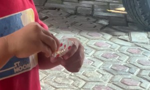 Kid Dips Fries In Closed Sauce Cup