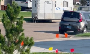 Lawn Sprinklers Offer Postal Worker Heat Relief