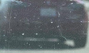 Car Drives With Sun Shield Up On California Freeway