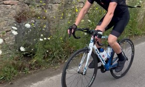 Bicyclist Gives Pup Piggyback Ride