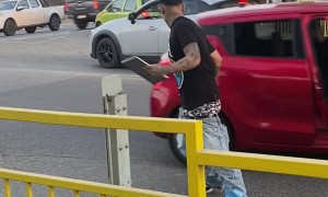 Man Gets Out of Moving a Car Without Missing a Beat