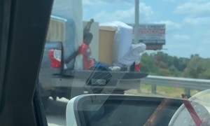 Hanging on in the Back of a Pickup Truck