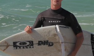 Surfer Stumbles and Snaps Board