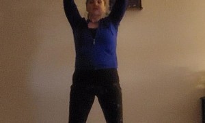 Woman Knocks Shelf Off the Wall While Doing Yoga