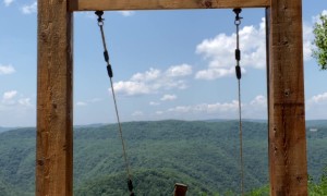 Kissing Couple Slowly Fall From Heavenly Swing