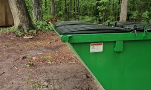Plank Helps Raccoon Escape Dumpster