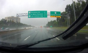 Truck Spins Out on Rainy Freeway