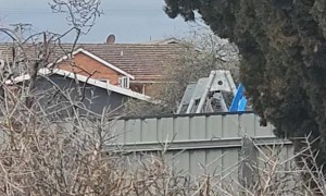 Man Reaches For Stars On Backyard Swing Set