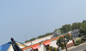 Caped Crusader Dances on Top of Car