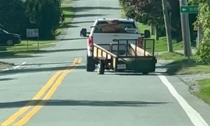Pickup Tows Precarious Trailer